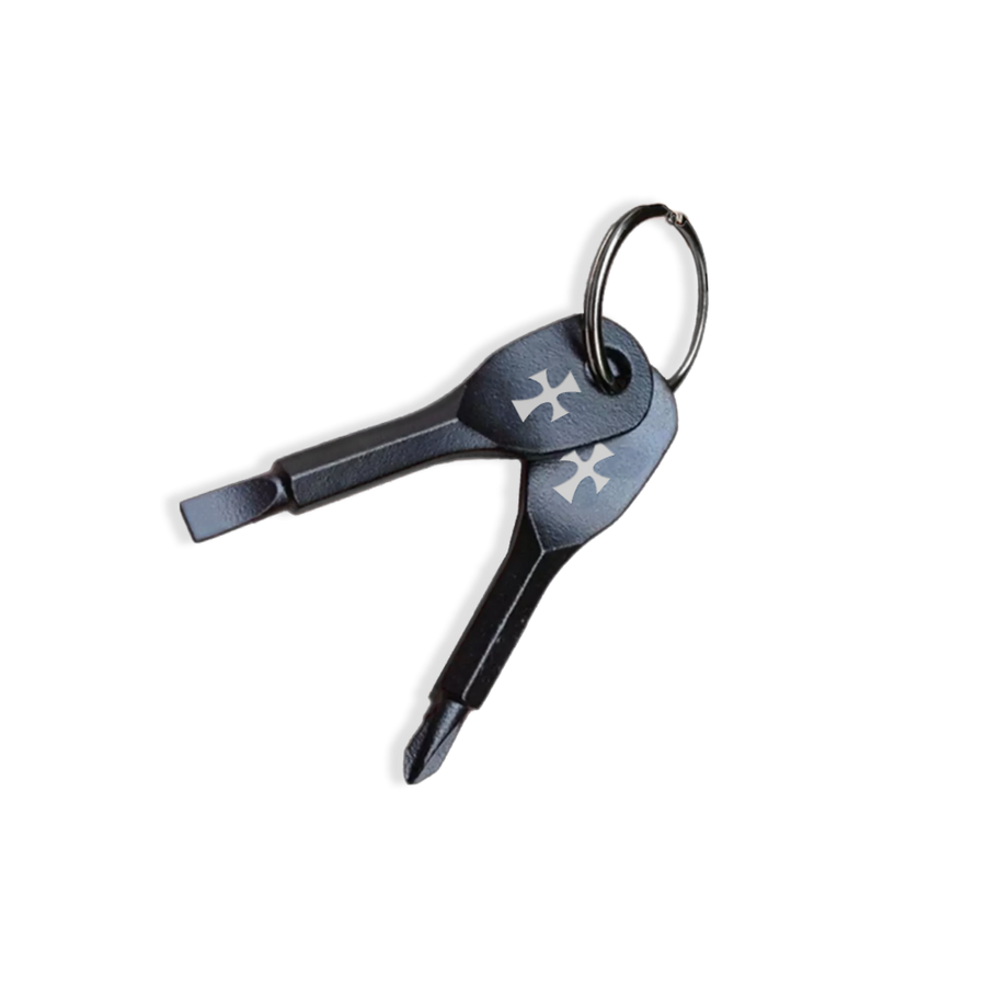 A black screwdriver keychain with a metallic finish and a keyring.